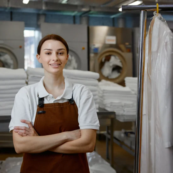 a-woman-worker-in-an-apron-stands-with-arms-crosse-2026-01-11-10-45-28-utc