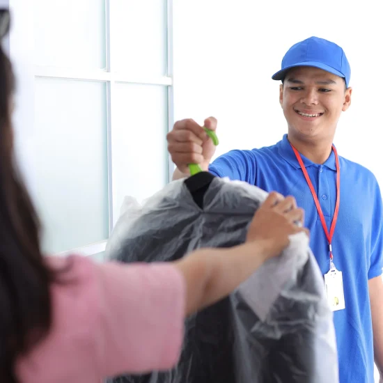 portrait-of-deliveryman-delivering-suit-to-custome-2026-01-09-10-21-37-utc